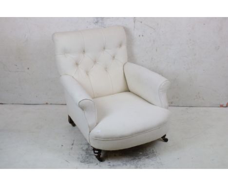 19th century Armchair, in the manner of Howard &amp; Sons, with cream button back upholstery, raised on turned front legs and