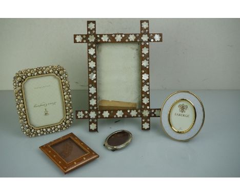 19th century rosewood and mother-of-pearl easel photograph frame, a Royal Collection ' Faberge ' enamel photograph frame and 