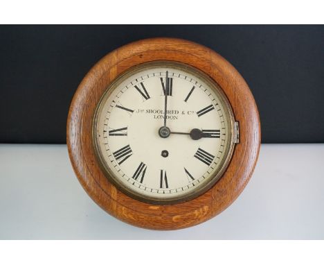 James Schoolbred &amp; Co London circular wooden cased wall clock, with enamel dial, poker and stick hands and Roman numerals