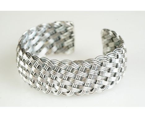 Silver cuff bangle in a woven laced style pattern 