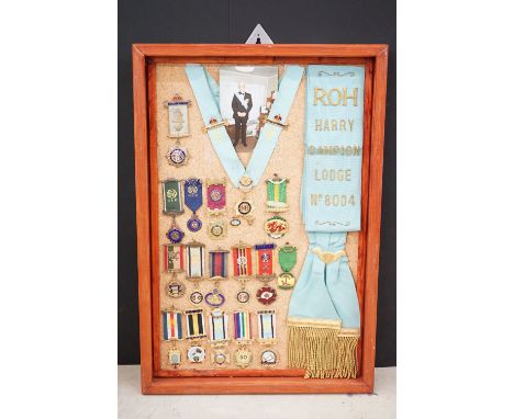 Collection of RAOB (Royal Antediluvian Order of Buffaloes) jewels, sash and collarette mounted in a wooden case, all awarded 