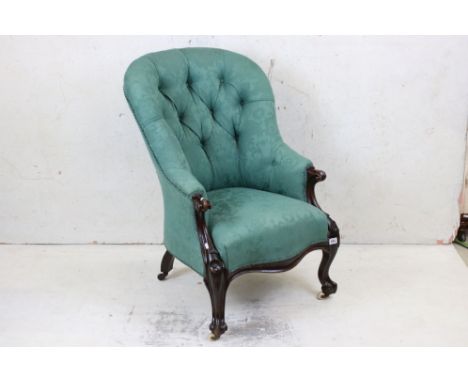 Victorian Green Button Back Upholstered Armchair with Mahogany Scrolling Carved Frame raised on castors, 65cm wide x 102cm hi