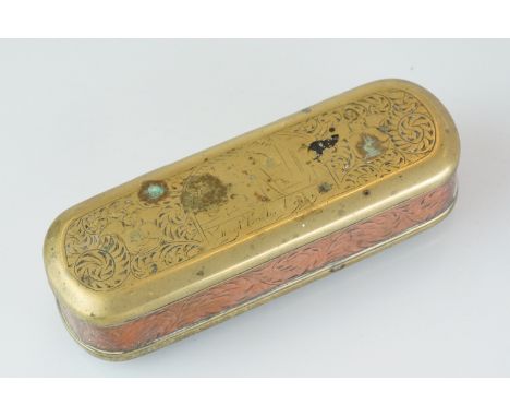 An antique 18th century brass and copper snuff box with ornate chased decoration. 