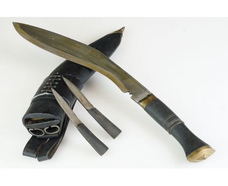 A Contemporary Gurkha Kukri knife complete with tools and scabbard. 