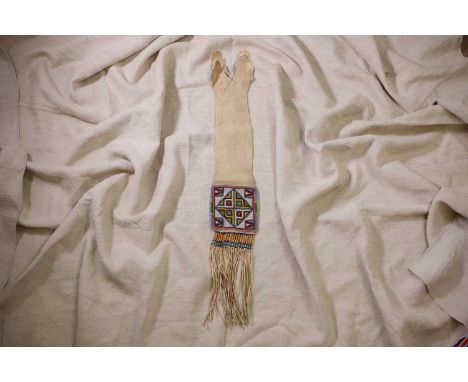 A Native American beaded hide tobacco or pipe bag, late 19th/early 20th century, Cree, sinew sewn with front and back panels 