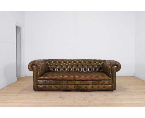 A Victorian-style chesterfield sofa, 20th century, with buttoned green leather, 212cm wide90cm deep77cm highProvenance: The D