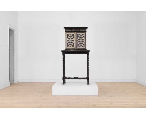 An ebonised fruitwood, ivory and bone cabinet, 17th century and later, North Italian, engraved throughout with fruit, foliate