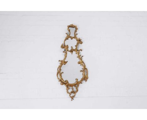 A Chippendale period carved and giltwood mirror, c.1765, the cartouche-shaped plate within a scrolling acanthus and 'C' scrol