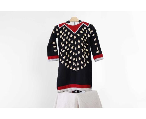 A Native American 'elk tooth' child's dress, 20th century, of navy and red cloth, the collar with a beaded strip, and sewn to