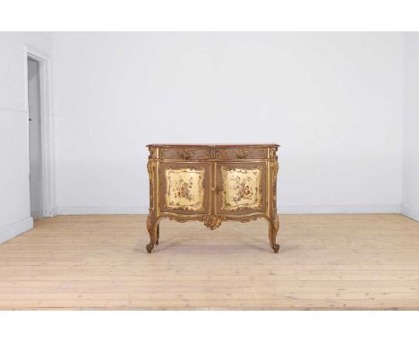 A painted and parcel-gilt wooden commode,  late 19th/early 20th century, Italian, of serpentine outline, decorated in the roc