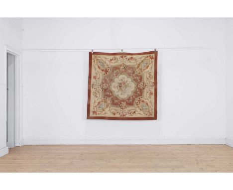 An Aubusson table tapestry or tapis de table, c.1840, French, of square form, with a medallion enclosing roses to the centre 