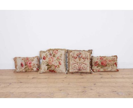 A collection of five Aubusson and Beauvais tapestry cushions, 18th century and later, mostly decorated with floral sprays,two