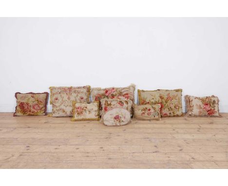 A collection of seven Aubusson and Beauvais tapestry cushions, 18th century and later, mostly decorated with floral sprays,th