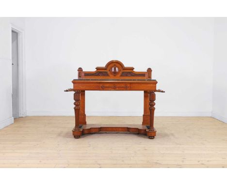 A Victorian oak hall table, c.1890, the shaped superstructure centred with a crest, above a fossil marble top and a single fr