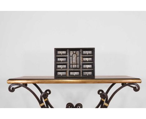 An ebonised wooden and ivory table cabinet,  19th century, North Italian, with incised geometric detail, set with an arrangem