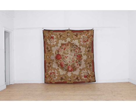 A Louis-Philippe Aubusson tapestry rug or tapis de table, c.1840, French, the shaped 'Turkish-taste' medallion filled with a 
