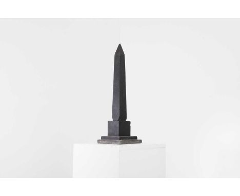 A black slate obelisk,  late 19th/early 20th century, raised on a plinth base, 15.2cm wide15.2cm deep47.5cm high