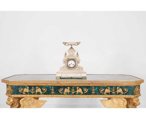 An onyx and gilt-mounted mantel clock, 19th century, French, surmounted with a twin-handled tazza, over an enamelled dial wit