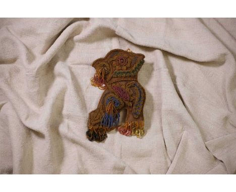 A Native American beaded whimsey or pincushion, late 19th/early 20th century, the stuffed high-heeled boot worked to the fron