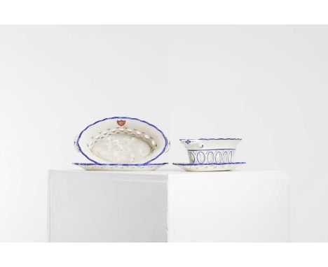 A pair of Spode creamware chestnut baskets on stands, c.1820-30s, each twin-handled basket painted with shield motifs and wit