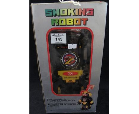 Smoking toy robot with bump N-Go function and flashing lights, in original box. (B.P. 24% incl. VAT)