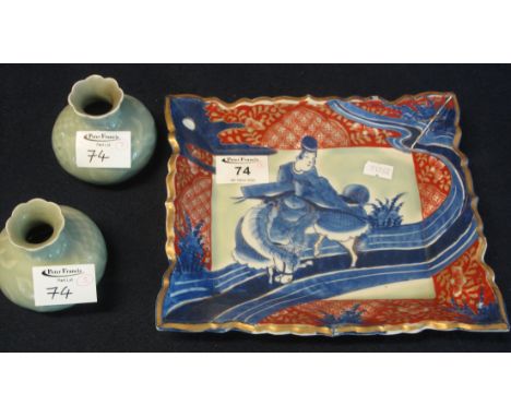 Japanese Arita oblong Imari tray depicting a mounted rider in blue and white on a celadon ground, together with a pair of min