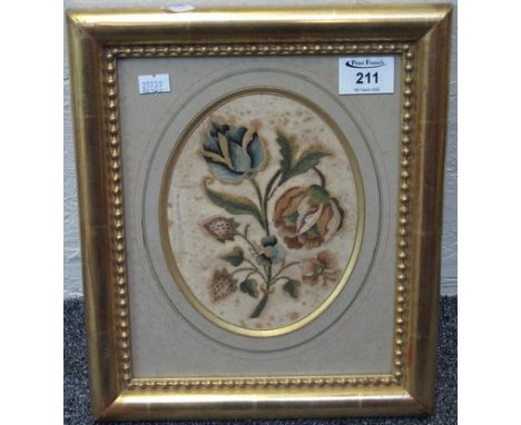 19th Century silk needlework panel depicting a spray of foliage, oval, double sided. 18 x 14cm approx. (B.P. 24% incl. VAT)