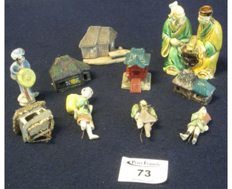 A ten piece group of Chinese ceramic items comprising figures in various pursuits and miniature model buildings.(B.P. 24% inc