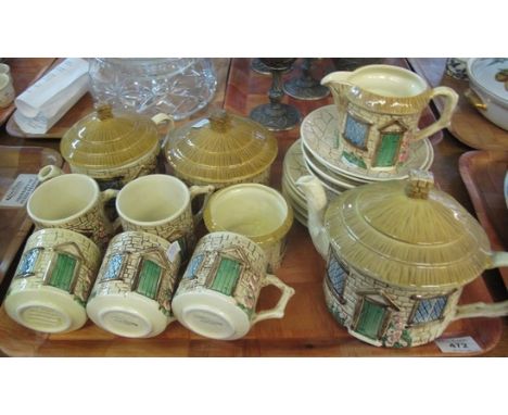 Tray of Sylvac ceramics teaware in the form of cottages, including; teapots, cream jug, lidded sucrier, cups, saucers etc. (B