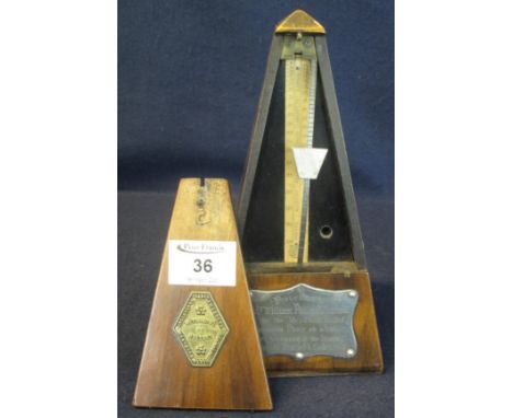 French walnut metronome with presentation plaque inscribed 'Presented to Mr William Phillips, White Mill by the Myrddin Unite