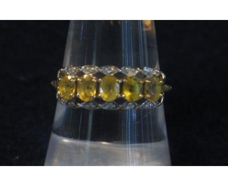 Yellow metal, five stone, yellow sapphire and diamond ring.(B.P. 24% incl. VAT)