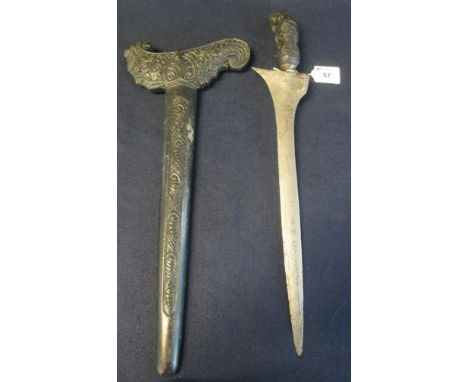 Indonesian Kris type dagger with carved wooden handle and hilt, steel blade and wooden scabbard. (B.P. 24% incl. VAT)