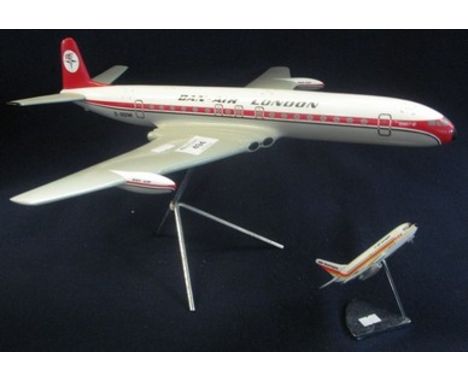 Model study of a Dan-Air Comet 4C airliner, together with a smaller Air Europe Boeing 737-200 airliner on chrome base. (2)(B.