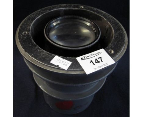 F2.9 camera lens in metal fitting, possibly from an aircraft. (B.P. 24% incl. VAT) CONDITION REPORT: Plaque with 'B. Cone, AM