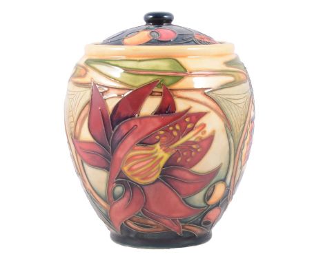 Moorcroft Pottery, a 'Hartgring' pattern jar and cover by Emma Bossons, 15cm.