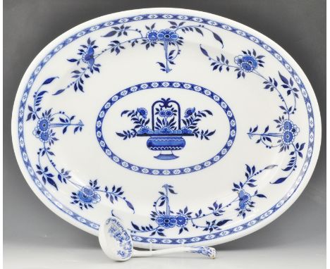 Minton printware oval meat plate, Delft pattern, width 49cm and a Staffordshire blue and white ladle (2).