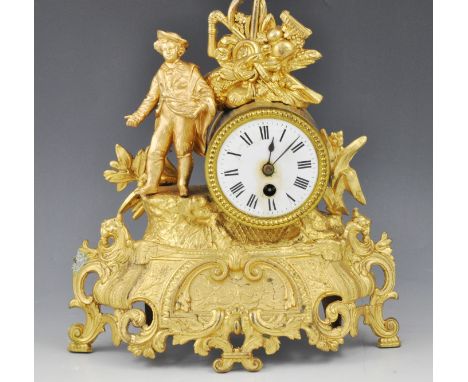 French gilt spelter mantel clock, off centre drum with white enamel dial, cylinder movement, cased designed with a farmer sew