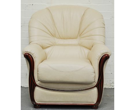 Contemporary light tan leather easy chair, stained wood frame, width 84cm.