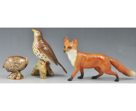 Beswick model of a Fox, length 22cm, a Beswick model of a Thrush No. 2908 and a Beswick novelty flask (3).