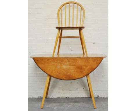 Ercol light elm dining suite, comprising drop leaf table with an oval top, 110cm, four hoop back chairs and a sideboard fitte