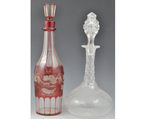 "Rock Crystal" type claret jug, wrythen moulded, 34cm, a ruby overlaid mallet shape decanter, other decanters and five tall w