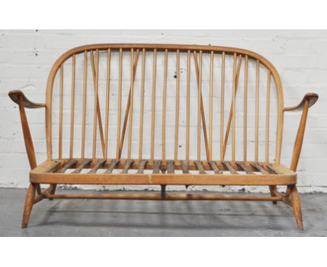 Ercol stained beechwood comb back chair, width 72cm and a settee frame (2).