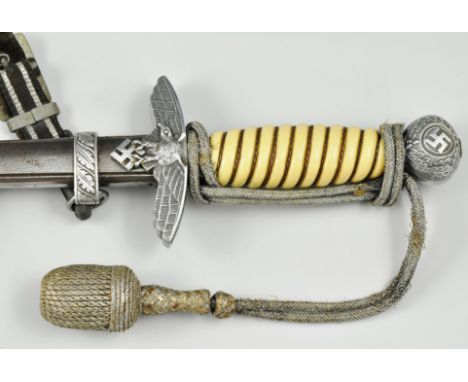 Luftwaffe Officers dress dagger, 24cm double edge blade, ivorine grip, with scabbard, sword knot and hanging straps.