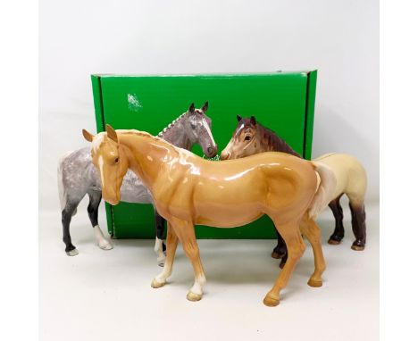 A Beswick highland pony, 1644, a mare, facing left, palomino, 976, both gloss, and a grey hunter, H260 (3)No obvious chips cr