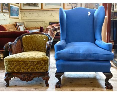 A wing back arm chair, and walnut framed arm chair (2)Wing back armchair no major faults found, structurally sound, coverings