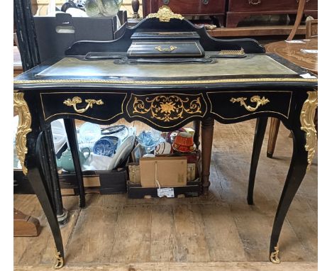 An early 20th century French ebonised writing desk, with gilt metal mounts, 97 cm wideTop has signs of wear and is slightly f