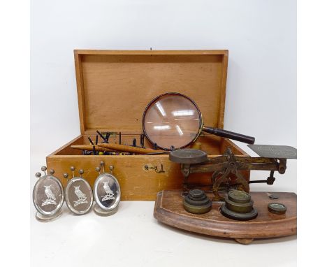 A set of three glass and silver coloured metal menu holders, decorated owls, a tortoiseshell framed magnifying glass, a set o