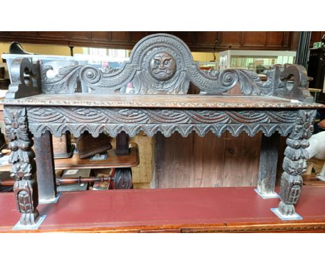 A carved oak window seat, 122 cm wide