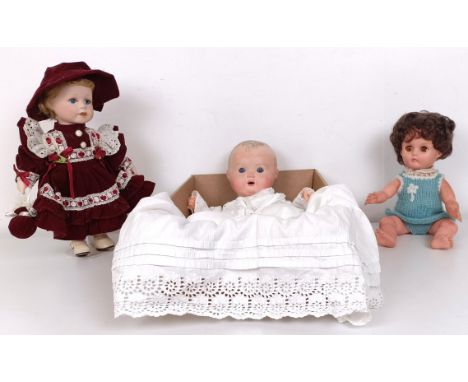 A Bisque headed doll and two others