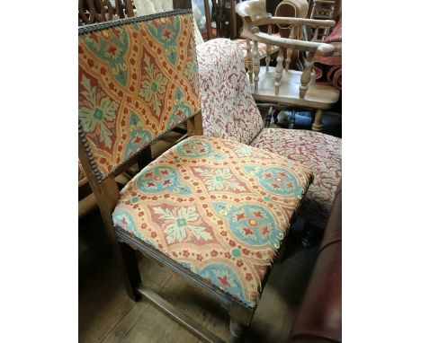 A smokers bow armchair, a pair of oak chairs upholstered in Pugin type fabric, and a nursing chair (4)